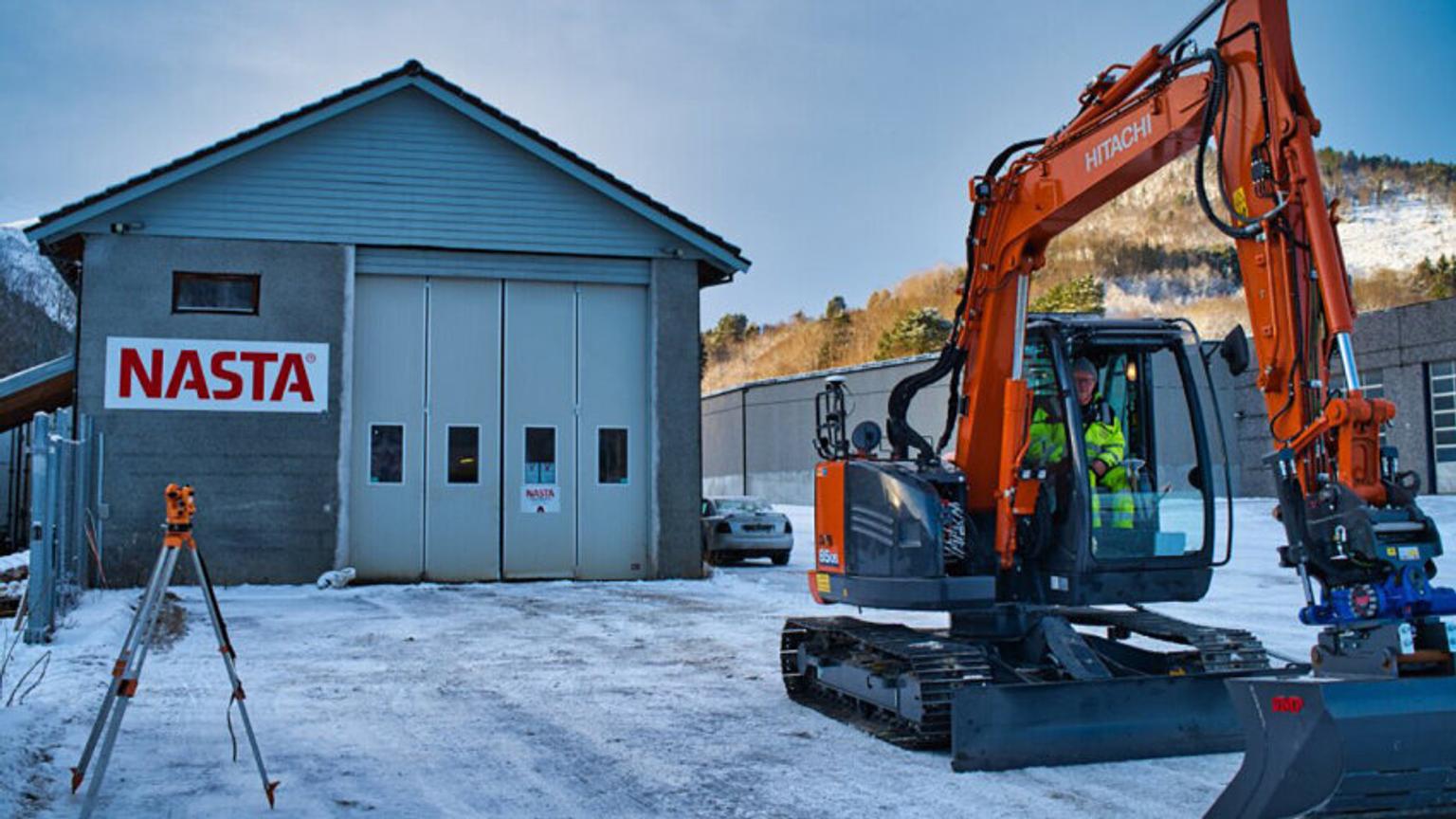 Excavator outside building